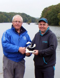Angling Trust director, David Kent, presents the special Triple Crown Trophy to Glenn Lawrence.