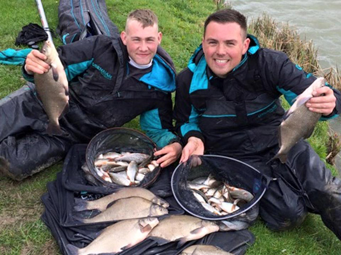 Matt Barnett (left) and Alex Clements with their catches from the England trials at Makins Fishery. 