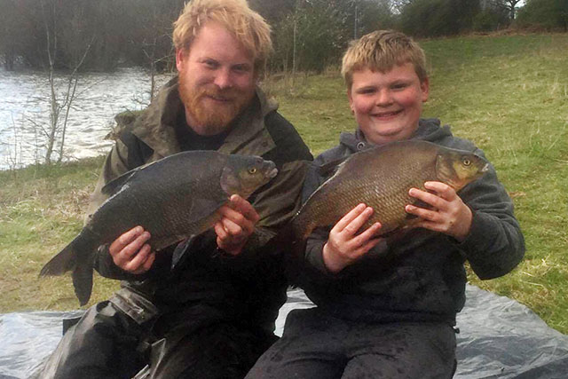 Kevin and Gethin with two bream from their huge catch.
