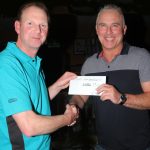 Chris Vandervleit collects his 4th place winnings from Drennan's Gary Barclay.